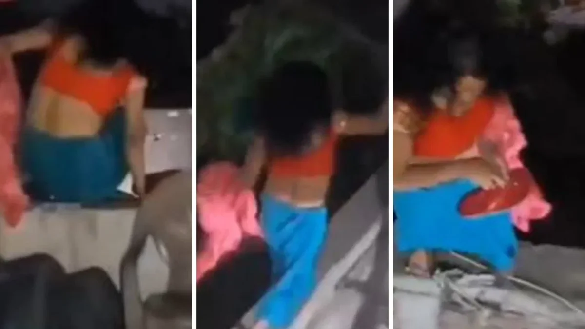 She was romancing in a closed room of a hotel, when the husband came with the kids... on seeing him the wife jumped over the wall and ran away, caught in the video