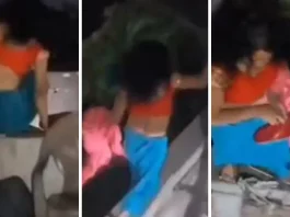 She was romancing in a closed room of a hotel, when the husband came with the kids... on seeing him the wife jumped over the wall and ran away, caught in the video